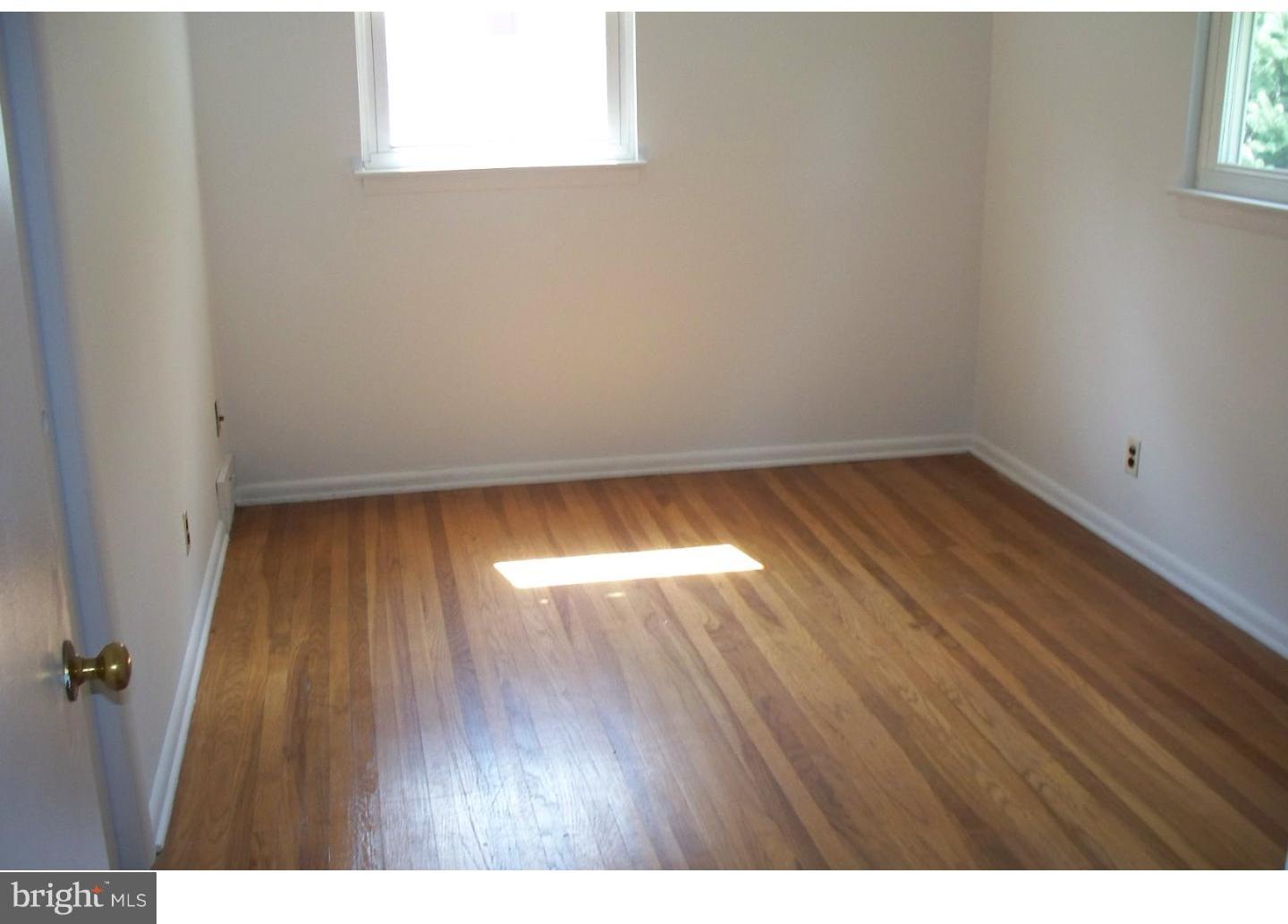 207 Spruce Road Flourtown, PA 19031 - Photo 12 of 19 a view of an empty room and wooden floor