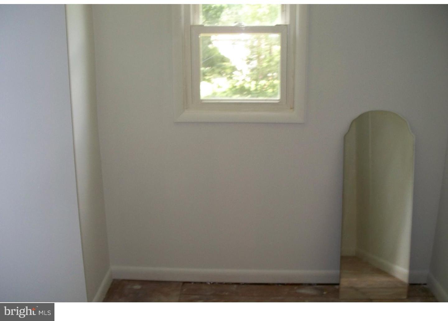 207 Spruce Road Flourtown, PA 19031 - Photo 15 of 19 a view of an empty room with a window