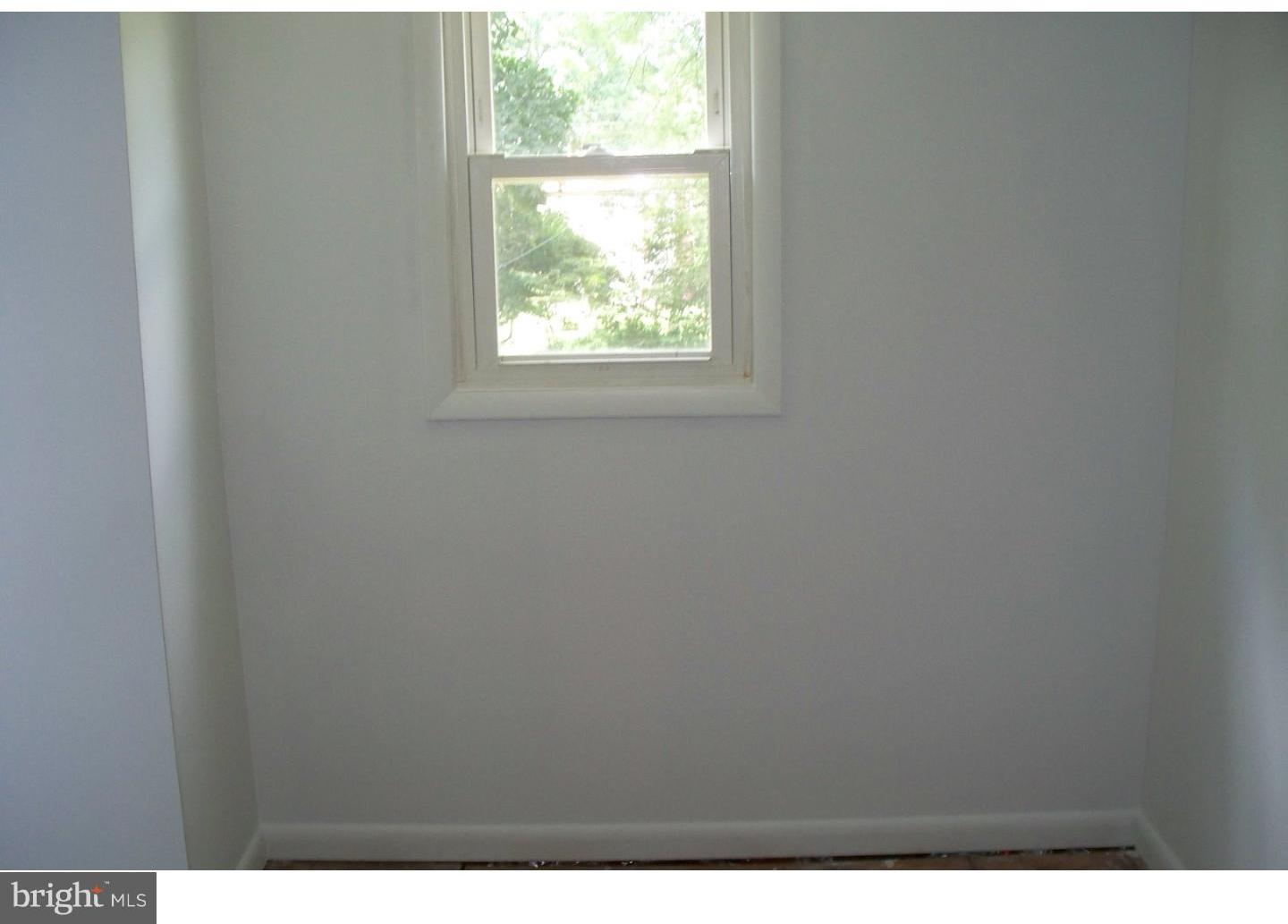 207 Spruce Road Flourtown, PA 19031 - Photo 16 of 19 a view of an empty room with a window