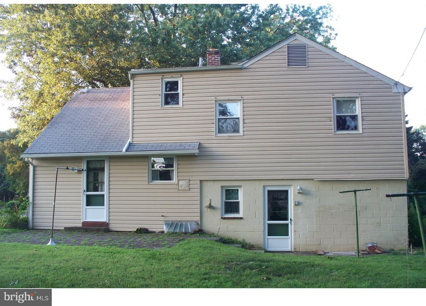 207 Spruce Road Flourtown, PA 19031 - Photo 2 of 19 a view of a house with a yard and a garage