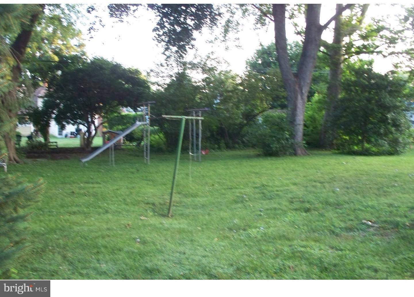 207 Spruce Road Flourtown, PA 19031 - Photo 3 of 19 a backyard of a house with lots of green space