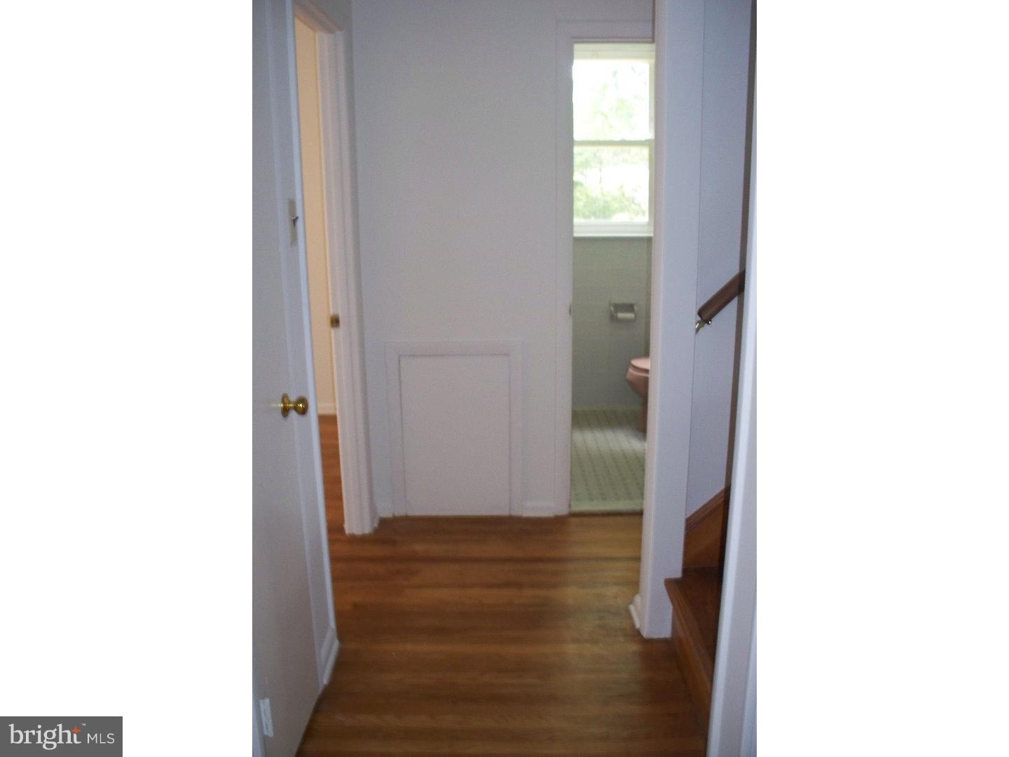 207 Spruce Road Flourtown, PA 19031 - Photo 7 of 19 a view of a hallway with wooden floor