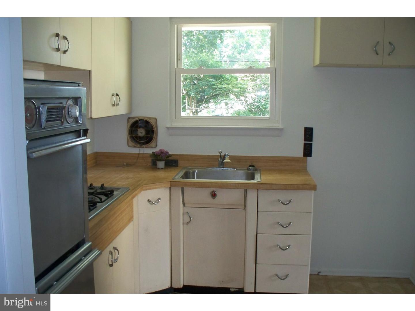 207 Spruce Road Flourtown, PA 19031 - Photo 8 of 19 a kitchen with a sink stove and refrigerator