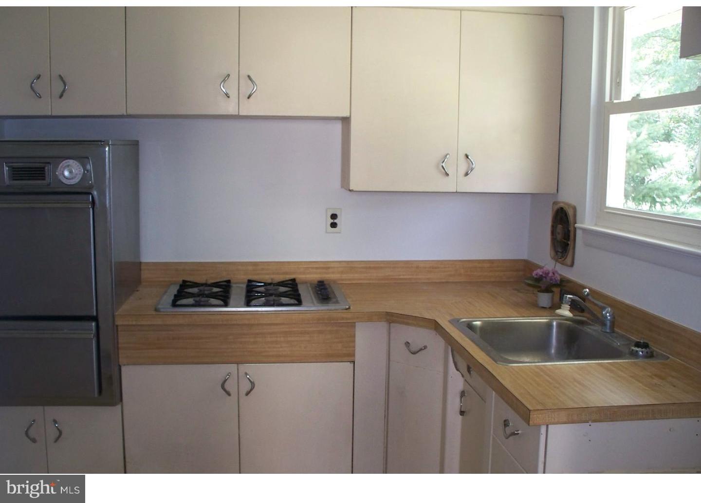 207 Spruce Road Flourtown, PA 19031 - Photo 9 of 19 a kitchen with a sink cabinets and appliances
