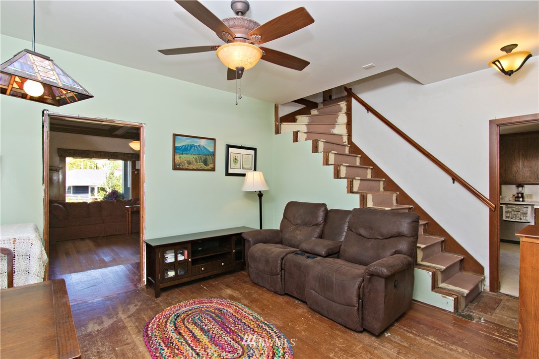 7501 California Avenue Southwest Seattle, WA 98136 - Photo 15 of 25 a living room with furniture and a wooden floor