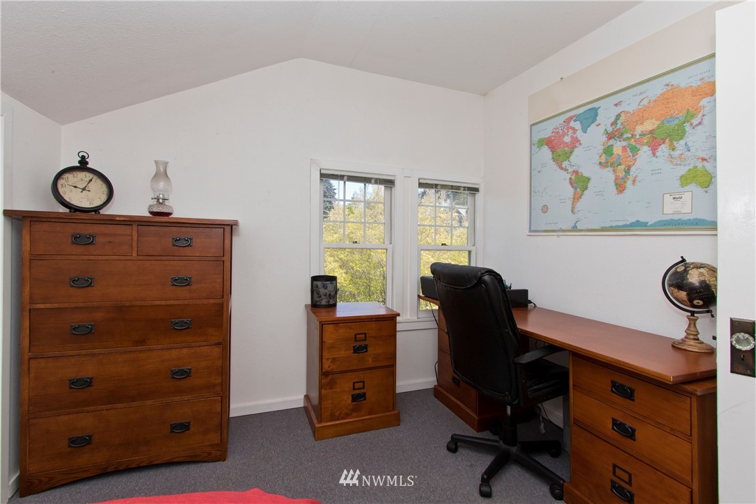 7501 California Avenue Southwest Seattle, WA 98136 - Photo 19 of 25 a view of a workspace with furniture and a window