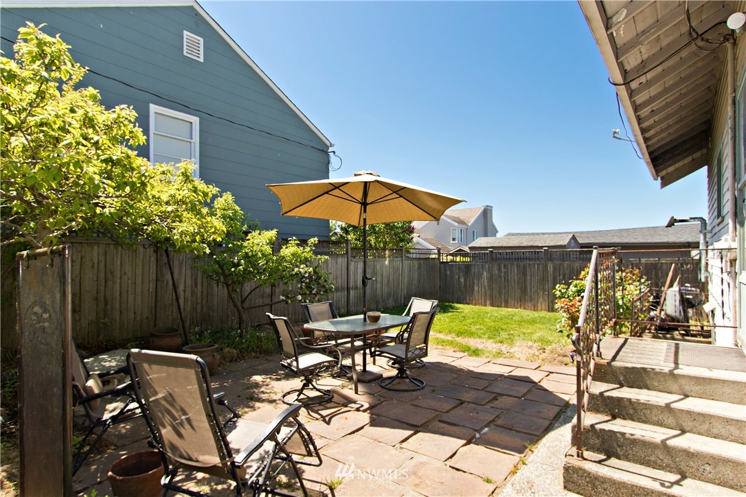 7501 California Avenue Southwest Seattle, WA 98136 - Photo 22 of 25 a view of backyard with outdoor seating and plants