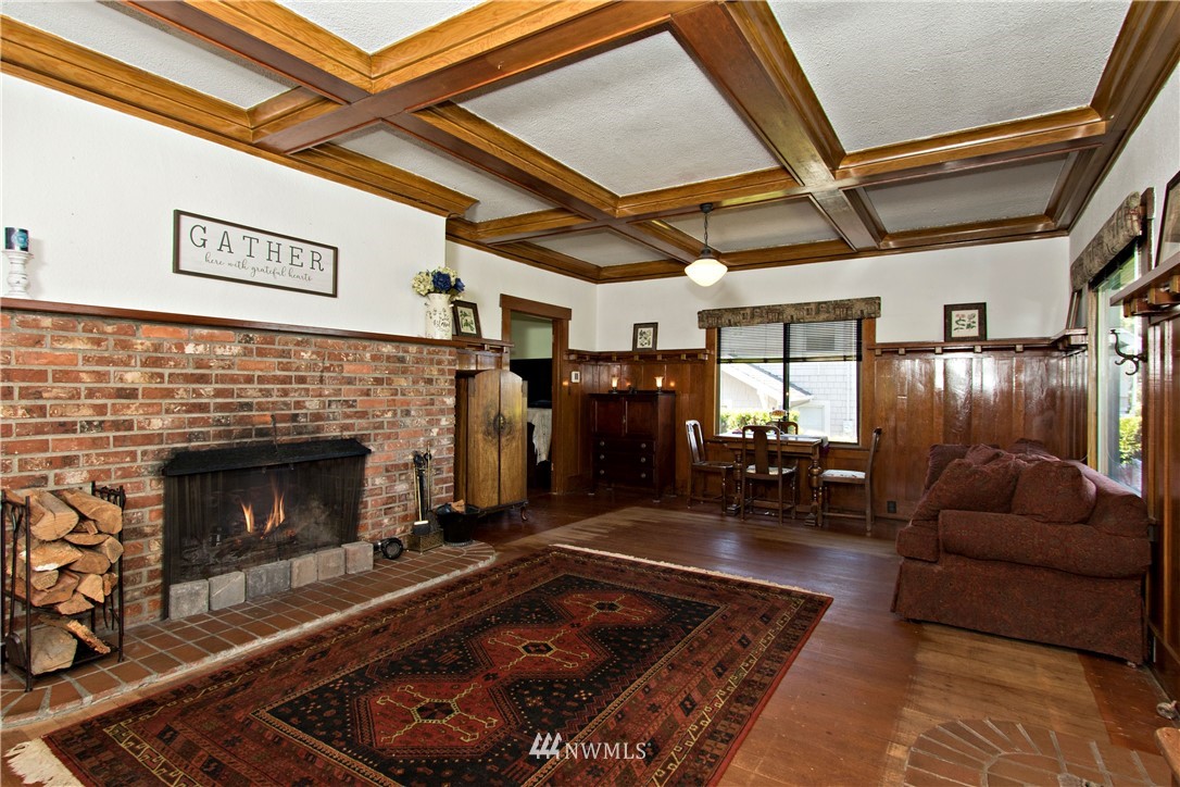 7501 California Avenue Southwest Seattle, WA 98136 - Photo 6 of 25 a living room with furniture and a fireplace