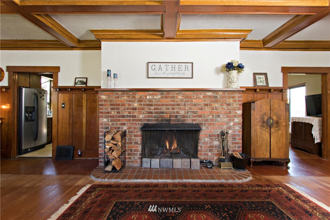 7501 California Avenue Southwest Seattle, WA 98136 - Photo 8 of 25 a living room with furniture and a fireplace