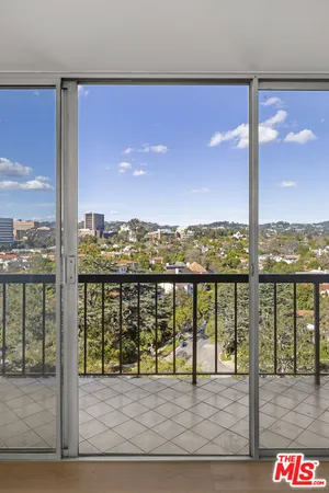 a view of a balcony with city view