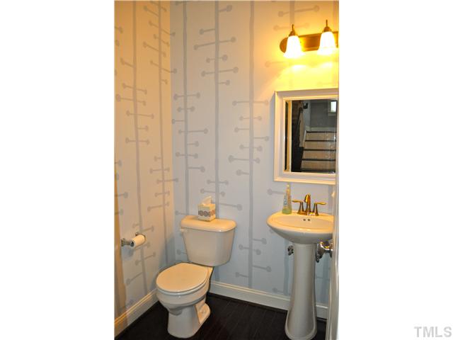 808 Pirouette Court Raleigh, NC 27606 - Photo 8 of 25 First floor powder room, clean as a whistle with custom paint.