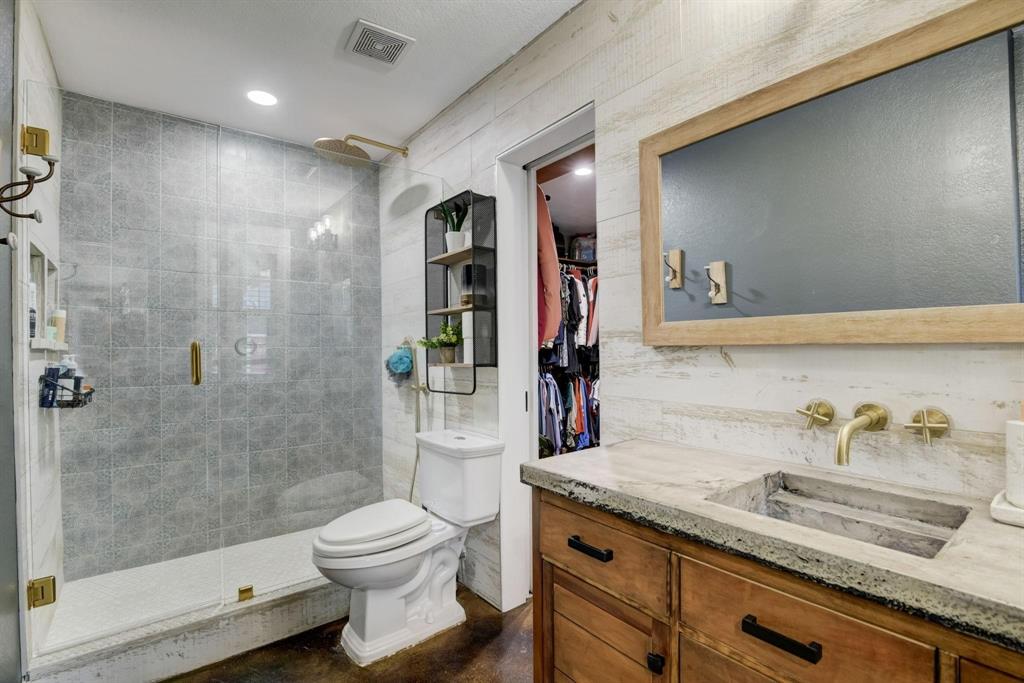 405 Hubbard Josephine, TX 75173 - Photo 11 of 17 a bathroom with a granite countertop sink a toilet and shower