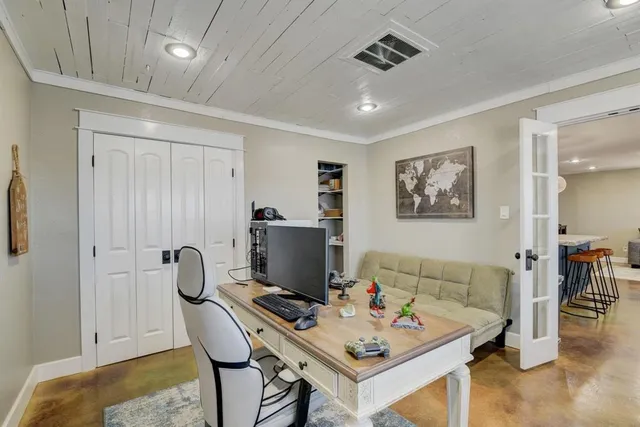 a workspace with furniture and window