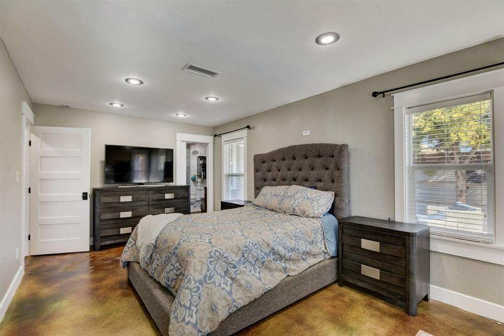 405 Hubbard Josephine, TX 75173 - Photo 10 of 17 a bedroom with a large bed and a flat screen tv