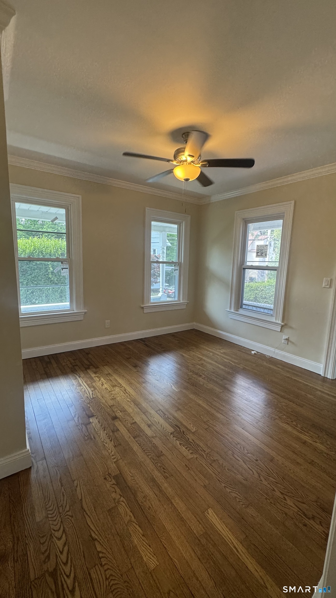 104 Prospect Street Ansonia, CT 06401 - Photo 17 of 40 wooden floor in an empty room with a window