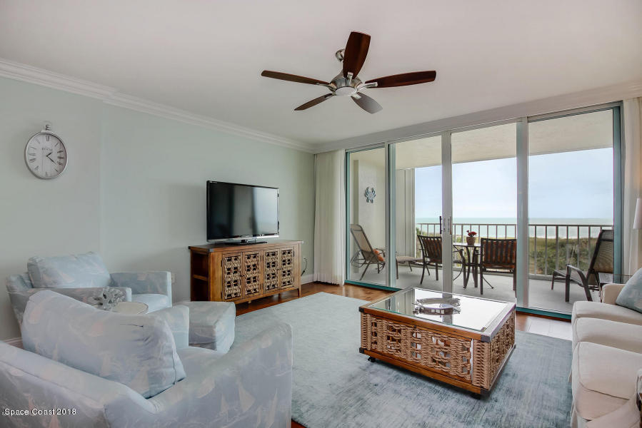 3400 Ocean Beach Boulevard, Unit 309 Cocoa Beach, FL 32931 - Photo 12 of 27 a living room with furniture