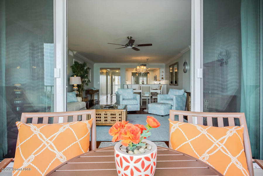 3400 Ocean Beach Boulevard, Unit 309 Cocoa Beach, FL 32931 - Photo 24 of 27 a outdoor space with furniture and wooden floor