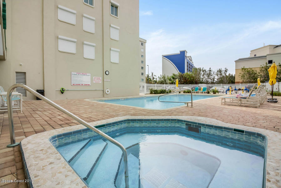 3400 Ocean Beach Boulevard, Unit 309 Cocoa Beach, FL 32931 - Photo 27 of 27 a view of a swimming pool with a patio