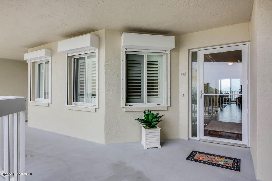 3400 Ocean Beach Boulevard, Unit 309 Cocoa Beach, FL 32931 - Photo 3 of 27 front view of a house with an entryway