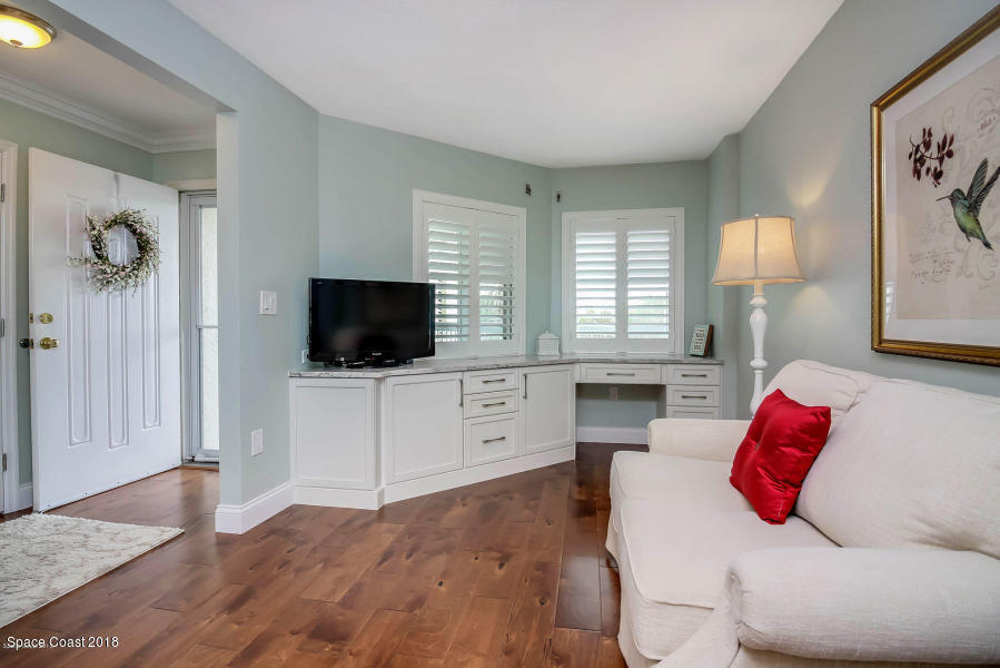 3400 Ocean Beach Boulevard, Unit 309 Cocoa Beach, FL 32931 - Photo 5 of 27 a bedroom with a bed and a flat screen tv