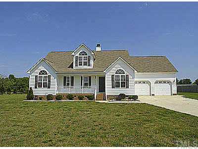 1005 Holland Ridge Drive Raleigh, NC 27603 - Photo 1 of 1 a front view of a house with a yard