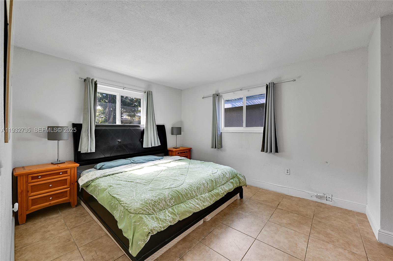 6500 Northwest 27th Street Sunrise, FL 33313 - Photo 11 of 16 a bedroom with a bed and window