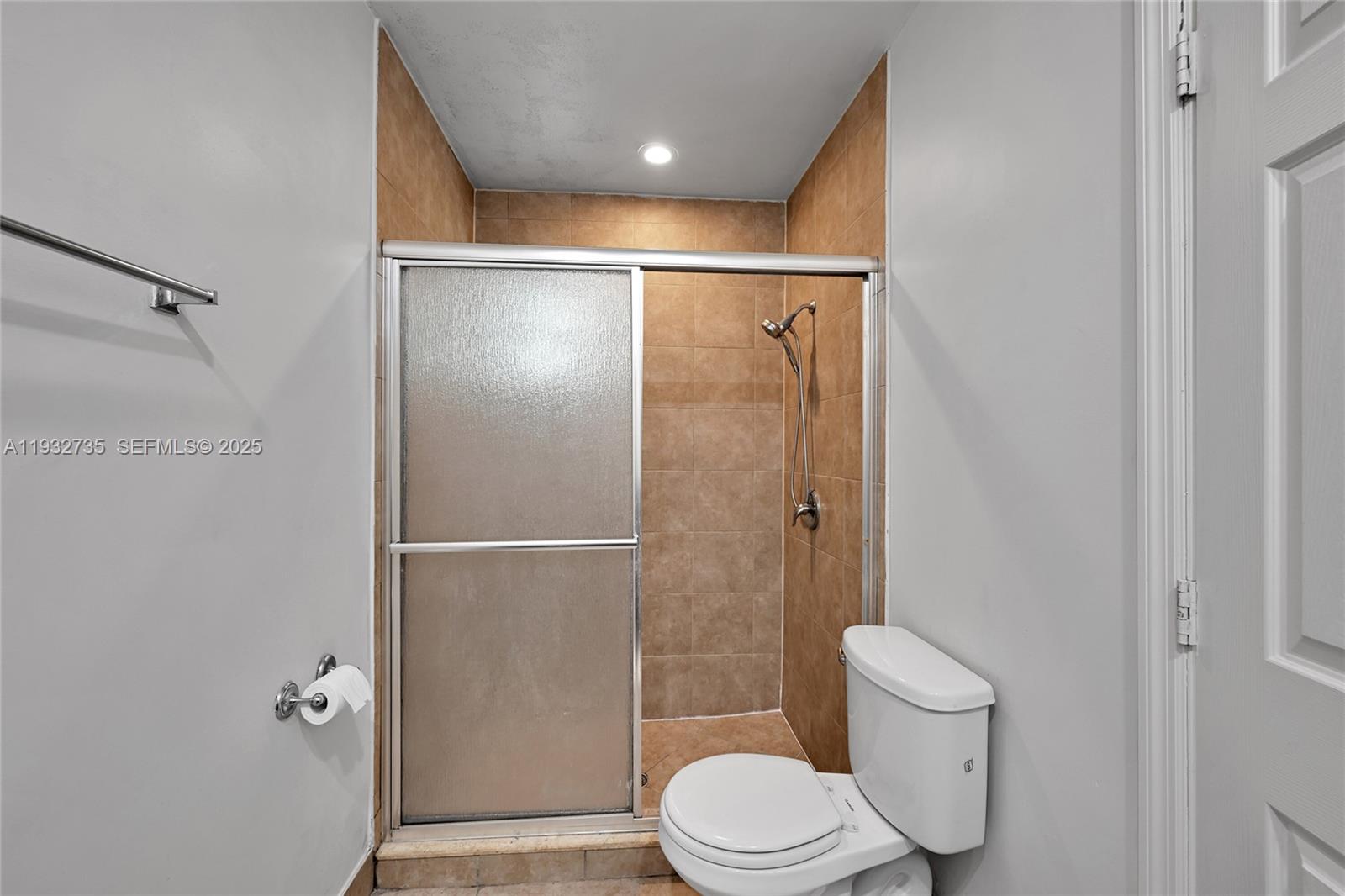 6500 Northwest 27th Street Sunrise, FL 33313 - Photo 13 of 16 a bathroom with a toilet and a shower