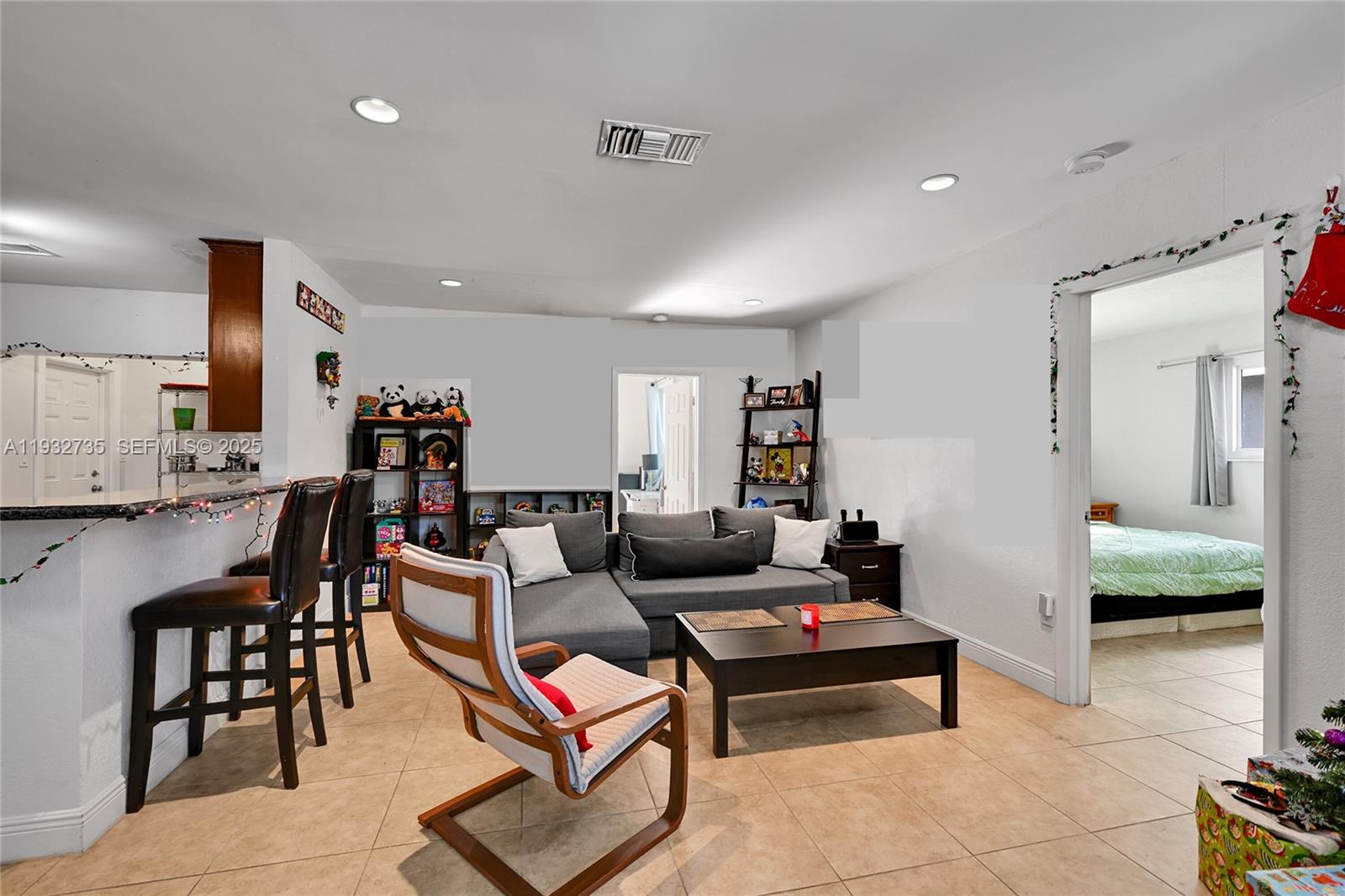 6500 Northwest 27th Street Sunrise, FL 33313 - Photo 3 of 16 a living room with furniture and a wooden floor