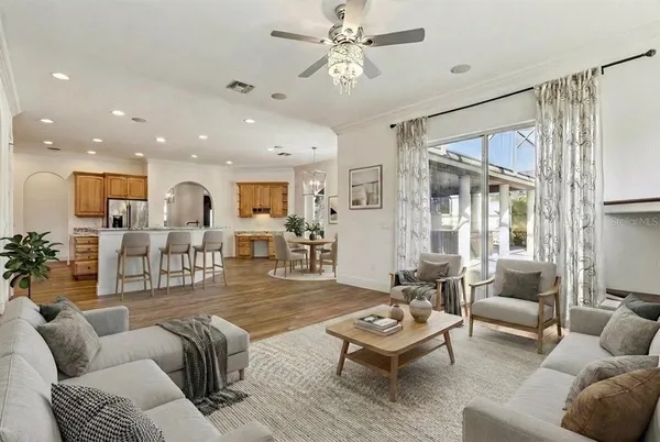 a kitchen with stainless steel appliances granite countertop a stove a sink and a refrigerator