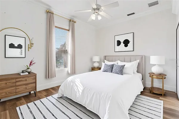 an aerial view of a house with a yard and lake view