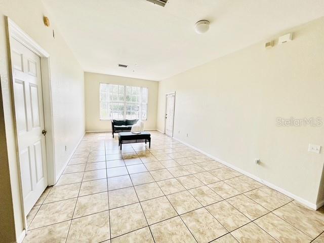 13500 Turtle Marsh Loop, Unit 825 Orlando, FL 32837 - Photo 8 of 19 a view of an empty room with a window