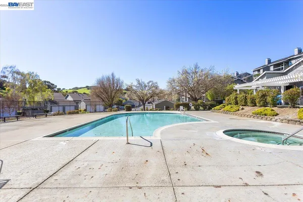 a view of outdoor space swimming pool and green space