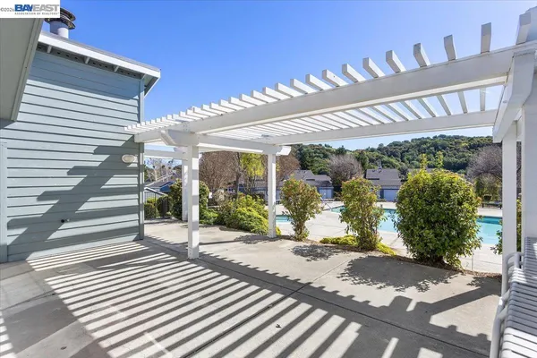 a view of a patio with table and chairs potted plants with wooden floor