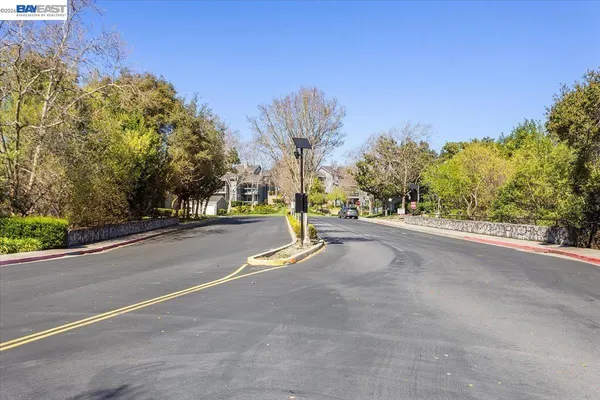 a view of a road with a building in the background