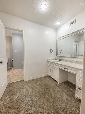 a view of a house with a yard and garage