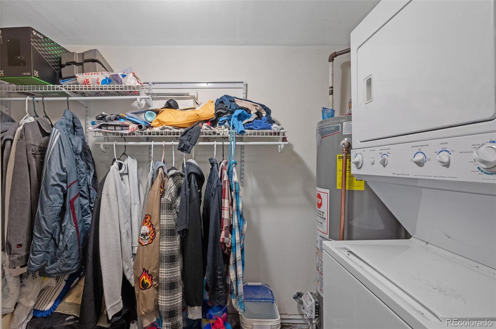 4956 Umatilla Street Denver, CO 80221 - Photo 17 of 33 a view of walk in closet with clothes and shoes