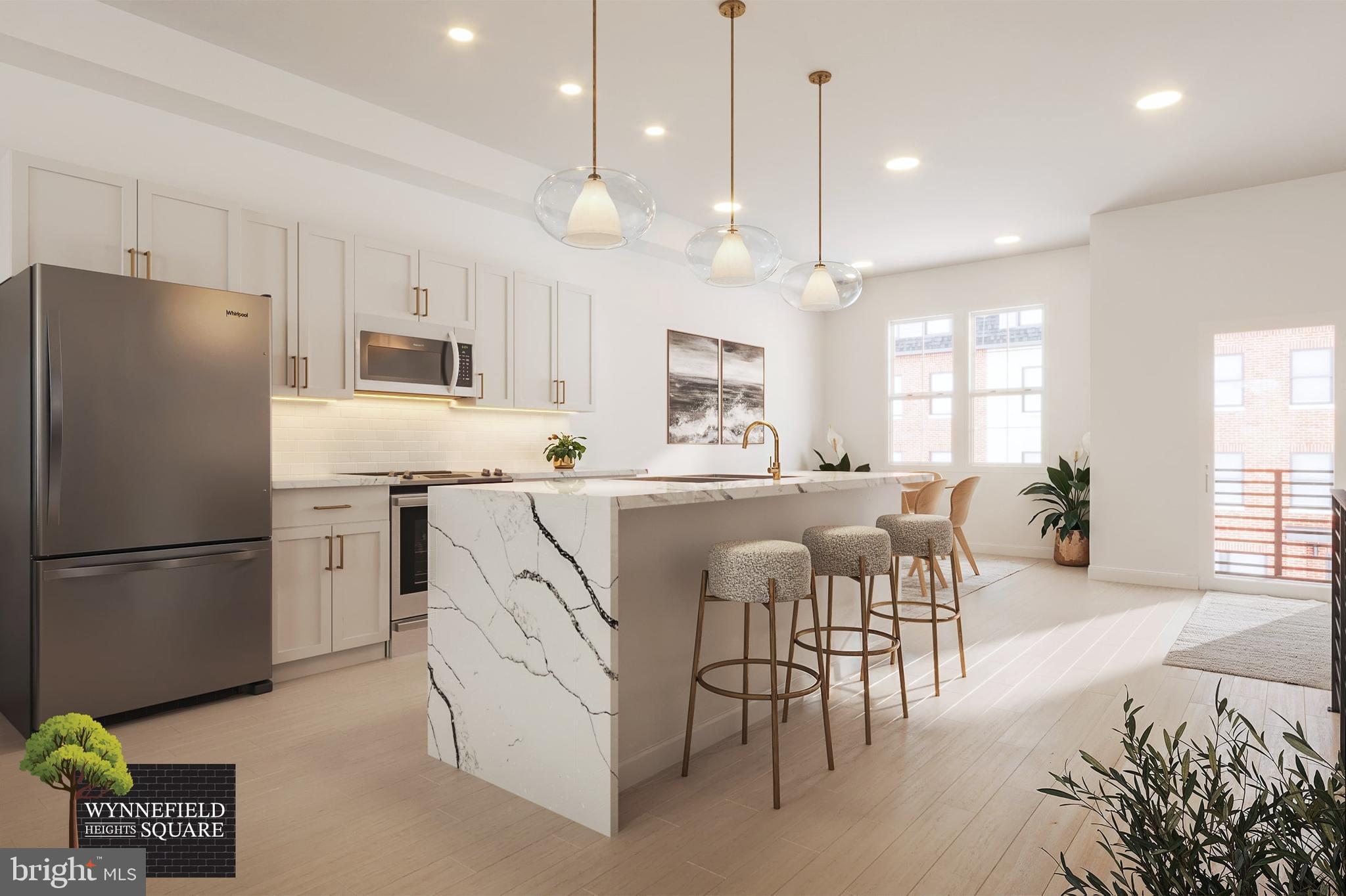 4066 Conshohocken Avenue, Unit A30 Philadelphia, PA 19131 - Photo 1 of 11 a kitchen with a refrigerator a dining table and chairs