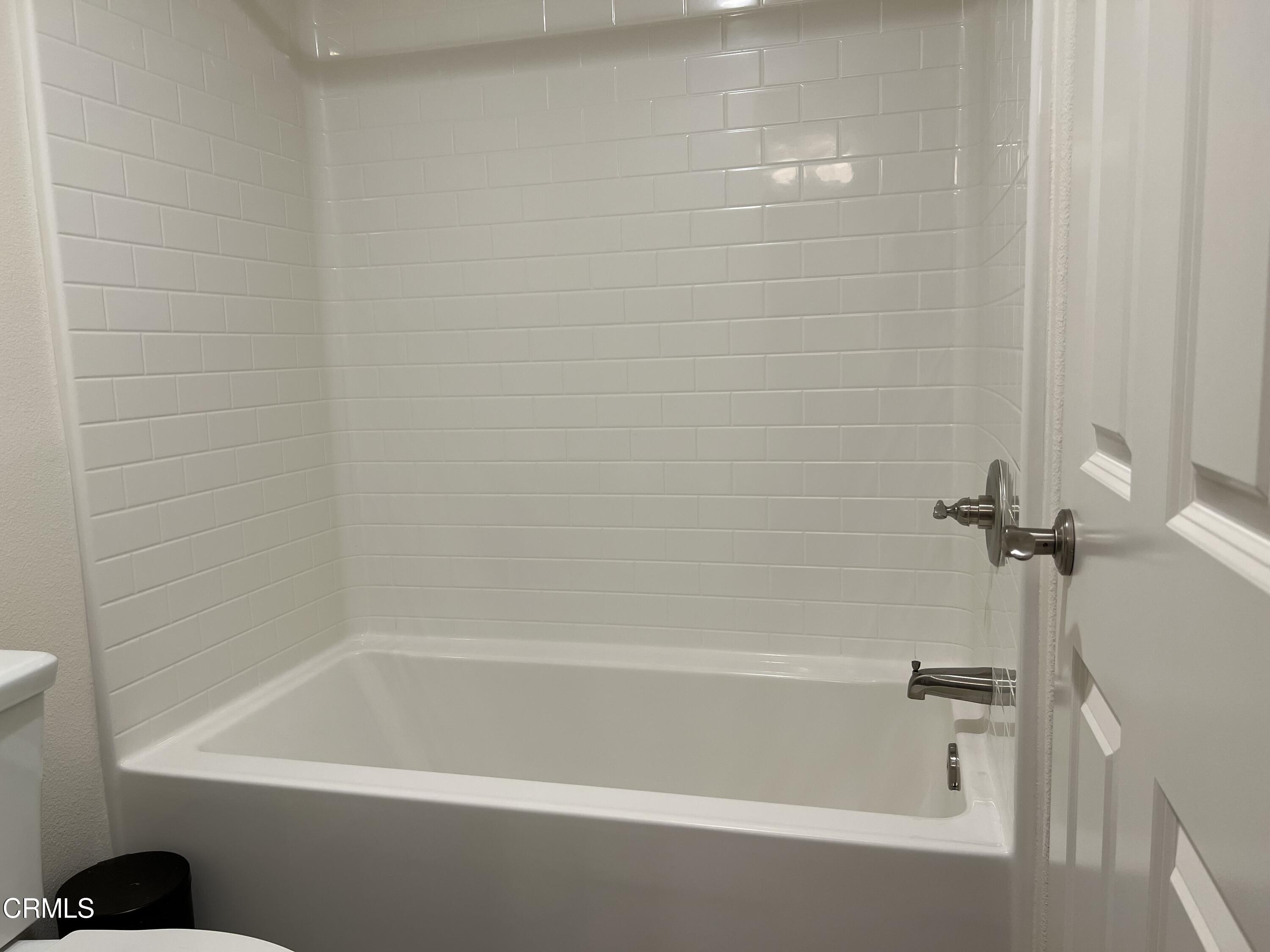 668 Owens River Drive Oxnard, CA 93036 - Photo 12 of 16 a close up of a bathtub in a bathroom