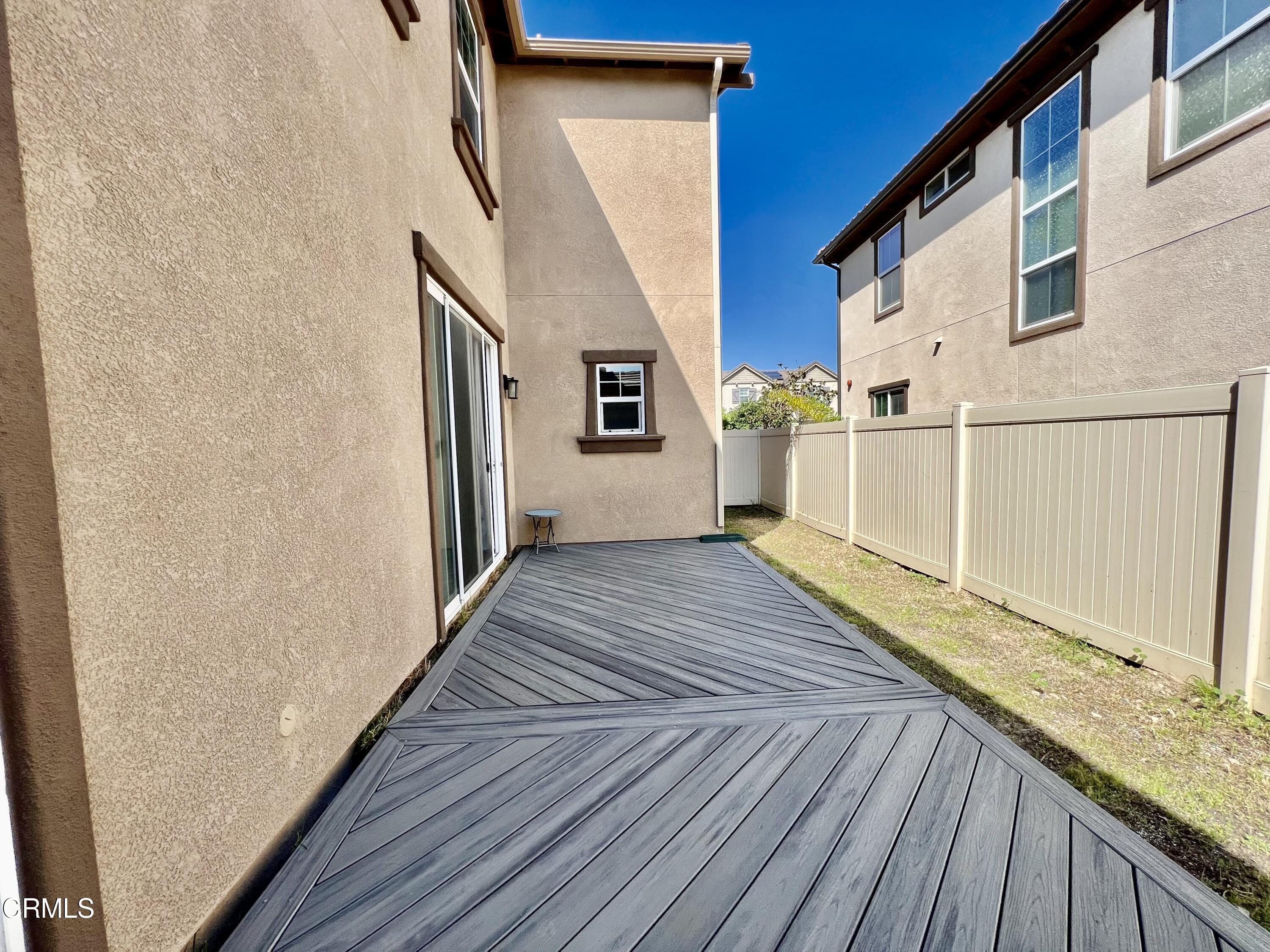 668 Owens River Drive Oxnard, CA 93036 - Photo 16 of 16 a view of a house with a wooden deck