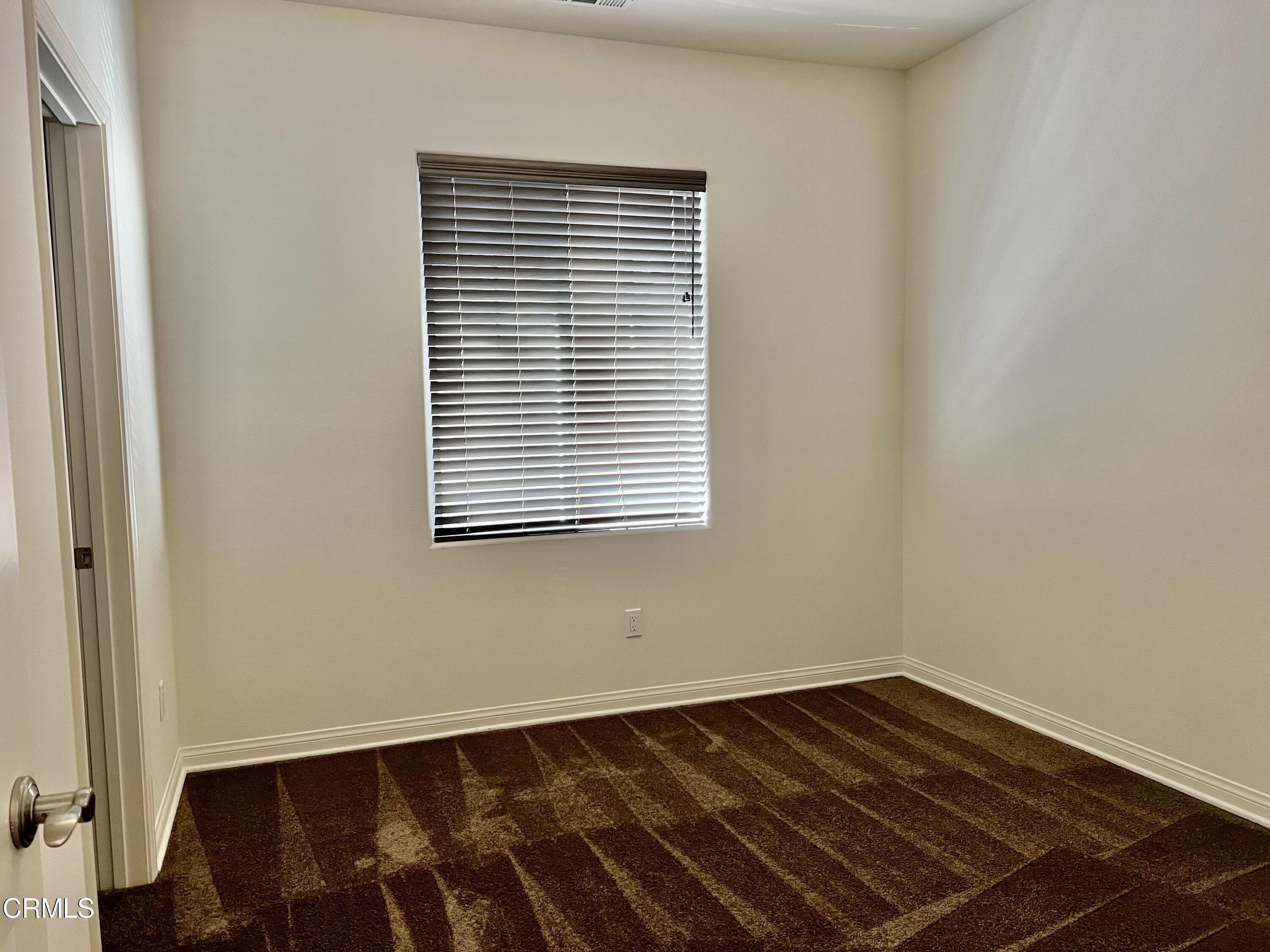 668 Owens River Drive Oxnard, CA 93036 - Photo 10 of 16 a view of a room with wooden floor and a window