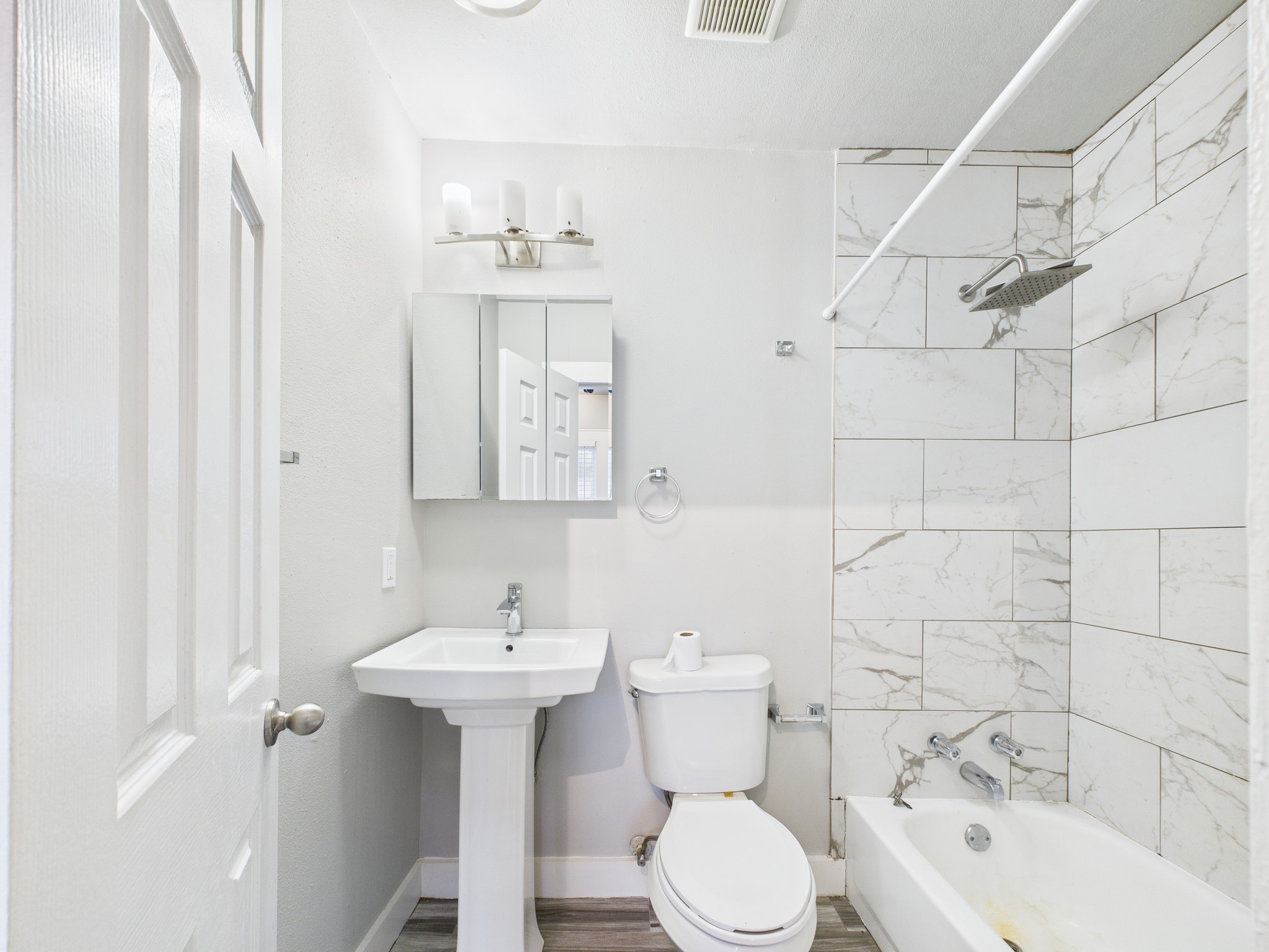 605 Enid Street, Unit 1 Houston, TX 77009 - Photo 5 of 9 a bathroom with a sink toilet and shower