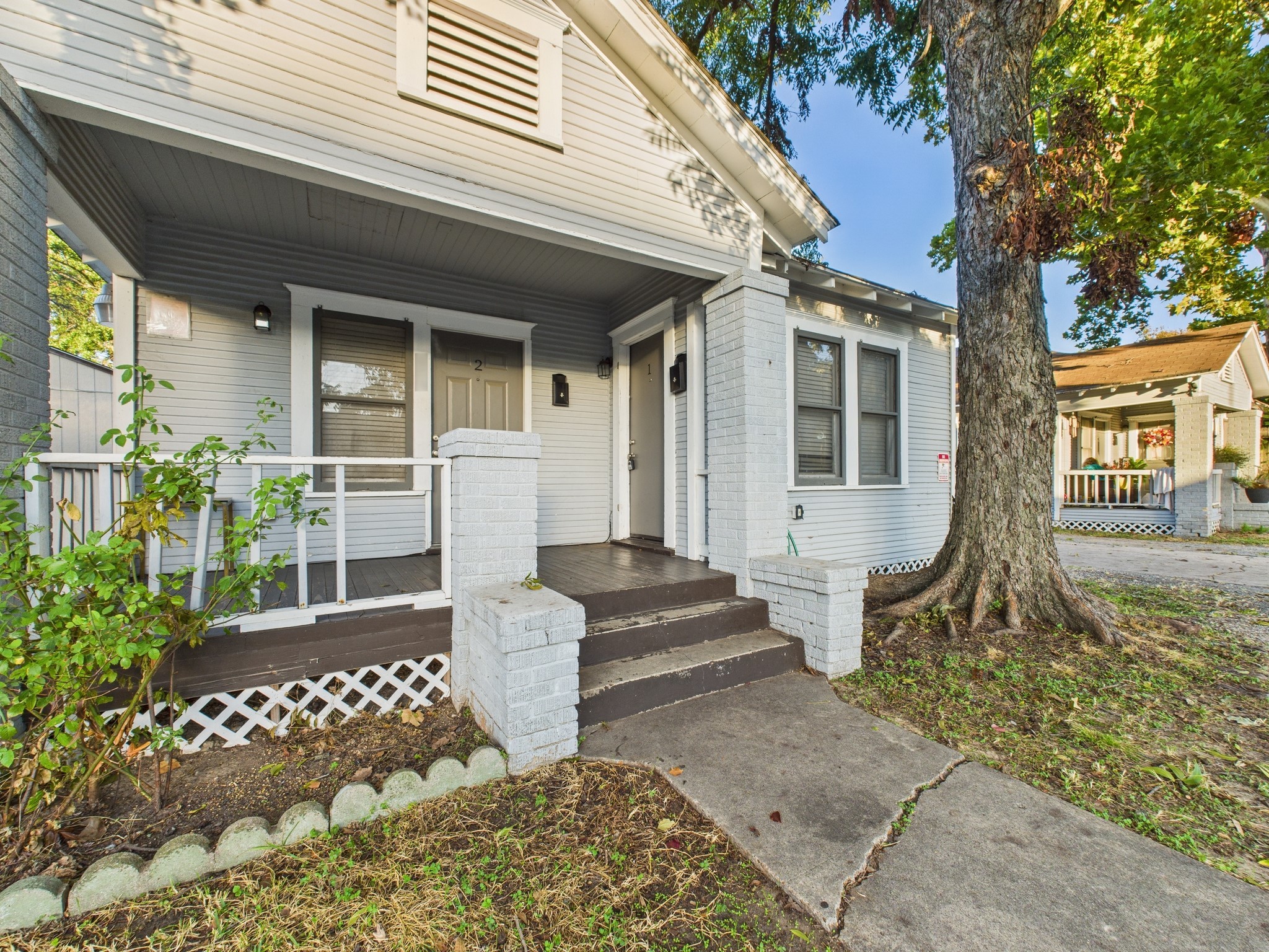 605 Enid Street, Unit 1 Houston, TX 77009 - Photo 9 of 9 a front view of a house with a garden