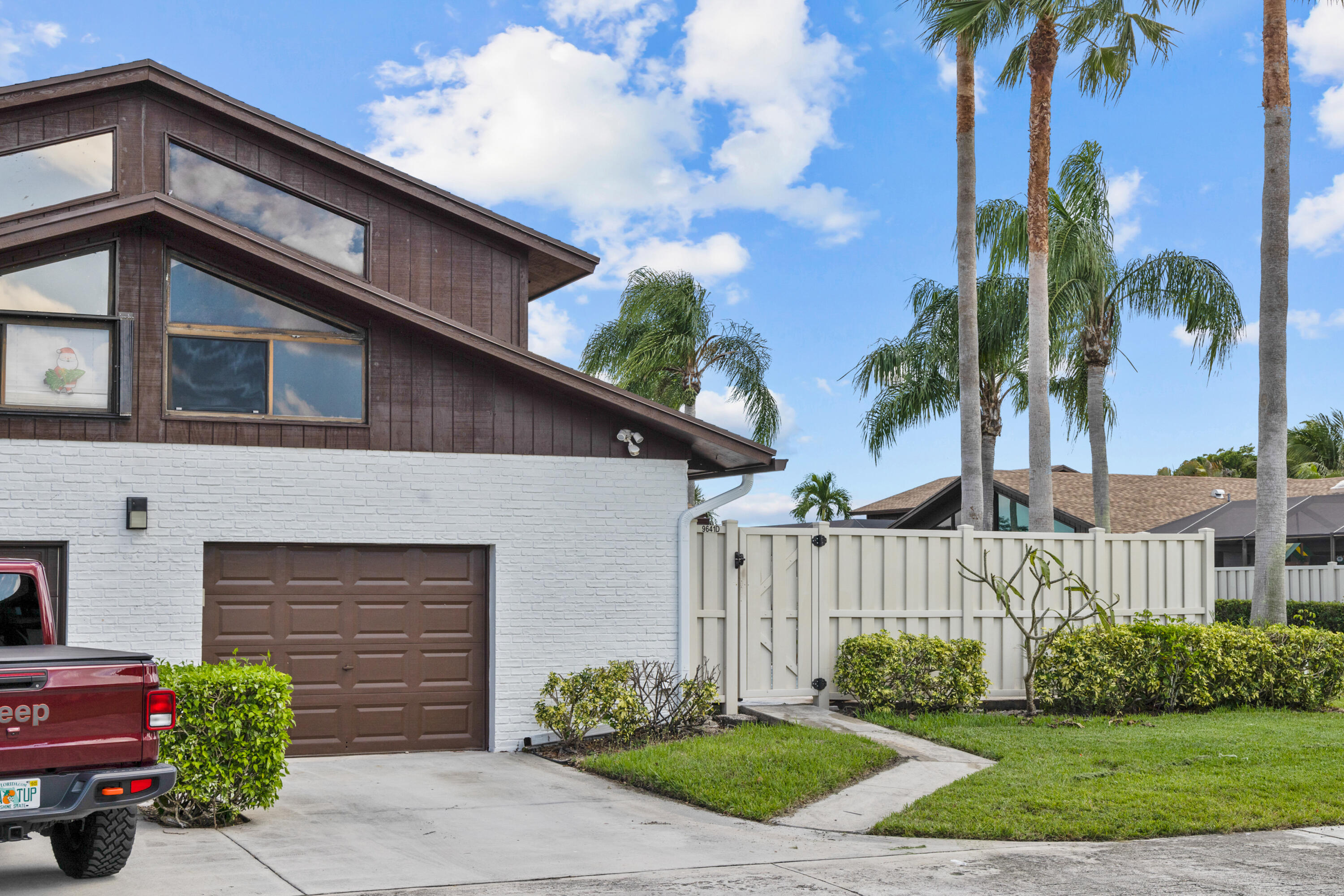 9641 Boca Gardens Parkway, Unit D Boca Raton, FL 33496 - Photo 1 of 27 Garage and gate entry
