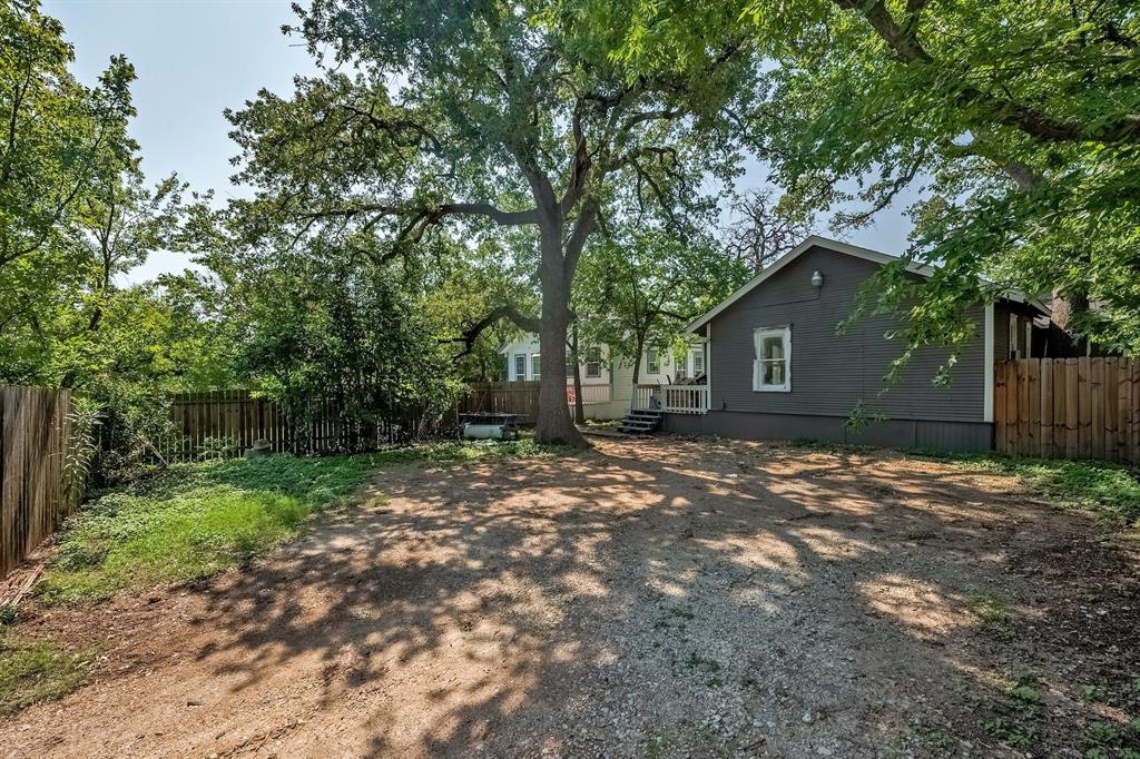 610 West 35th Street, Unit B Austin, TX 78705 - Photo 23 of 23 Fenced backyard featuring a deck