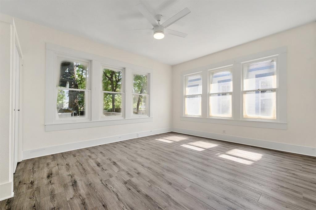 610 West 35th Street, Unit B Austin, TX 78705 - Photo 9 of 23 Empty room with a ceiling fan and light wood-style flooring