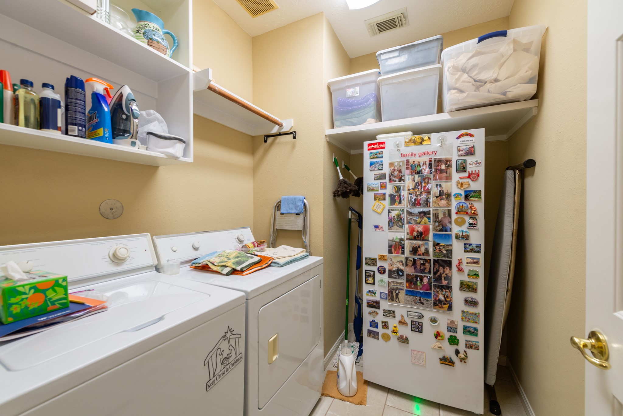 5230 Sandyfields Lane Katy, TX 77494 - Photo 19 of 24 Dedicated laundry room with built-in shelving, upper storage, and space for full-size washer and dryer.