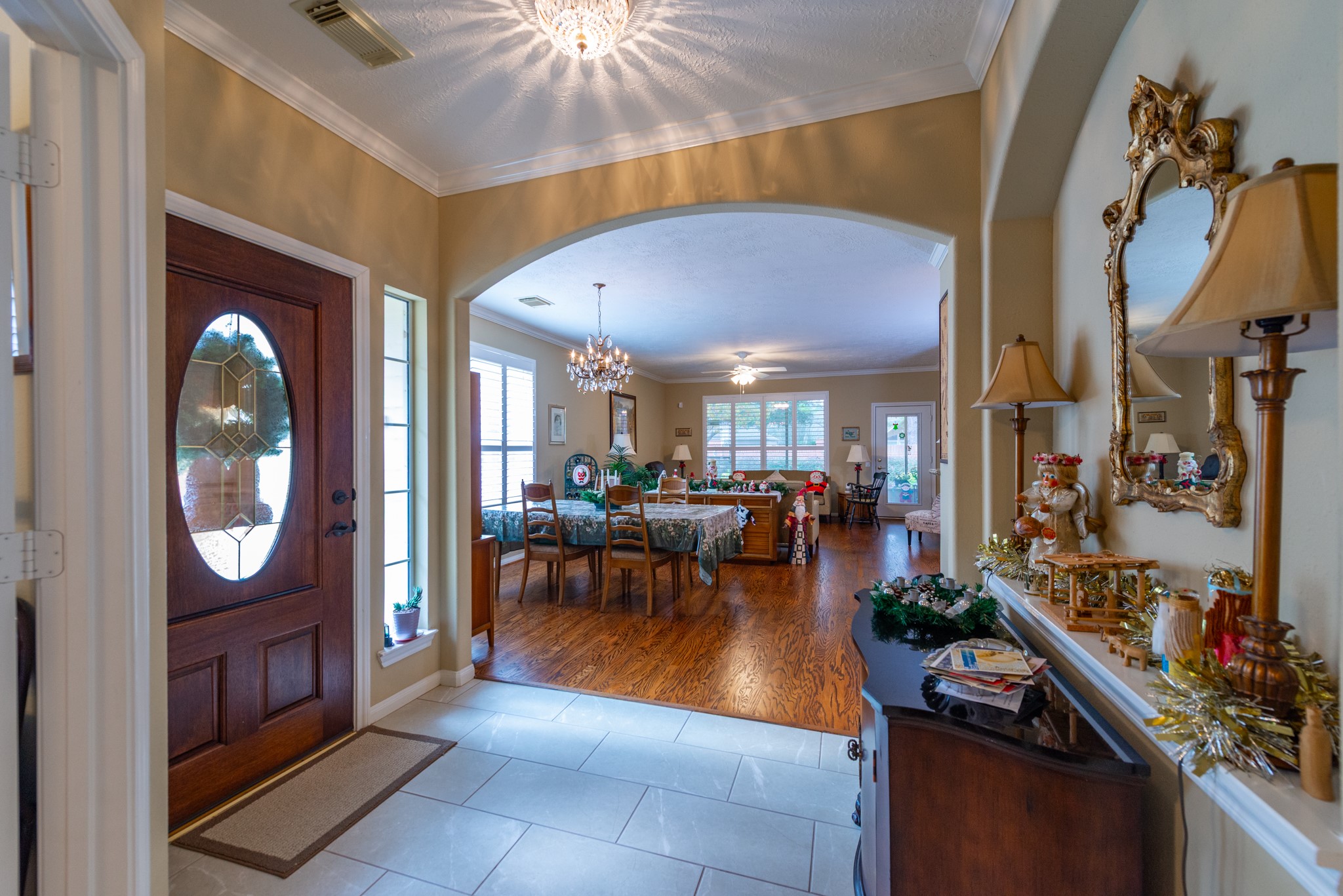 5230 Sandyfields Lane Katy, TX 77494 - Photo 6 of 24 Spacious foyer opens seamlessly into the main living and dining areas, highlighting the home’s open flow and beautiful hardwood floors.