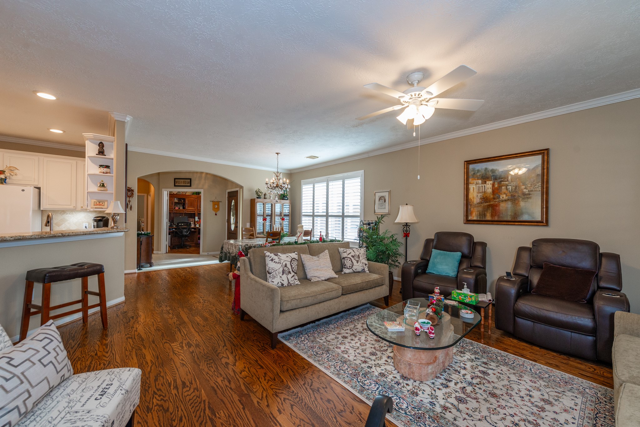 5230 Sandyfields Lane Katy, TX 77494 - Photo 10 of 24 Expansive open-concept living area offering excellent sightlines to the kitchen and dining spaces, designed for easy living and entertaining.