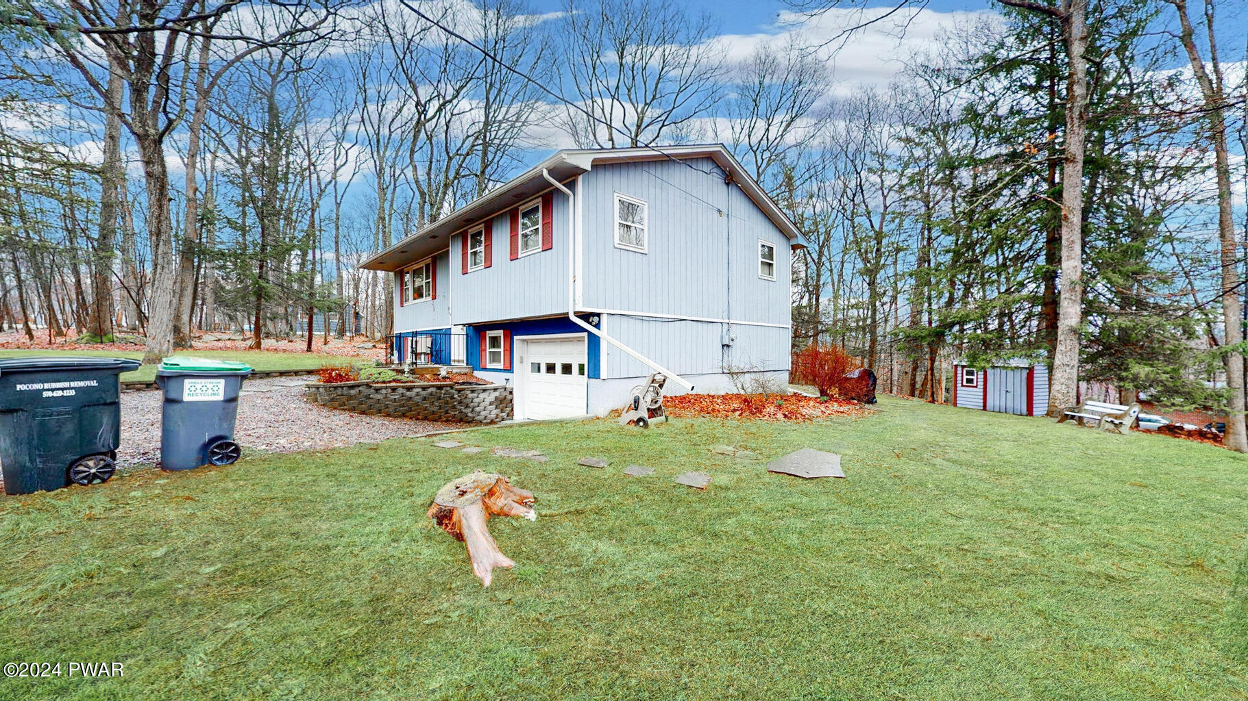 134 Sunnylands Road Milford, PA 18337 - Photo 16 of 59 a front view of a house with a yard and trees