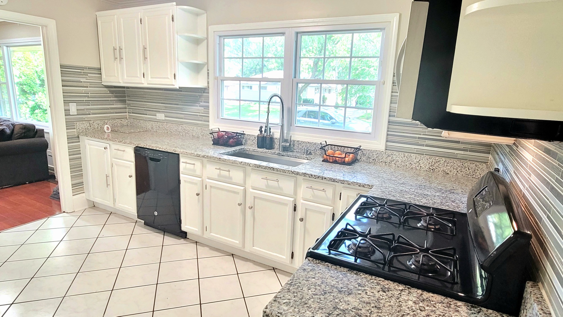 18 Manor Road Lake Zurich, IL 60047 - Photo 10 of 33 a kitchen with stainless steel appliances granite countertop a stove a sink and a microwave